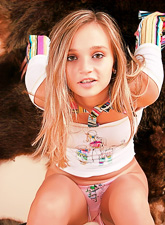 Cute and attractive blonde teen Kristina Fey takes off her pink jeans and shows off.