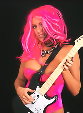 Kinky pink hairred babe Ember Reigns strips her pink corset and shows her boobs.