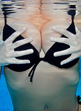 Busty teen model Sweet Krissy takes off her bikini in the pool and shows her rack.