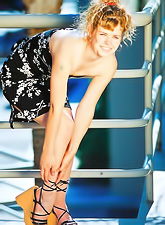 Ella Milano strips all of her clothes and then licks her sexy bare hot feet.