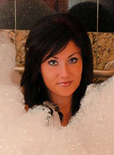 Horny brunette chick Sweet Krissy takes off her clothes and takes a hot bubbly bath.