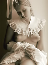 Koika takes her vintage clothes off and teases us in sexy stockings on the chair.