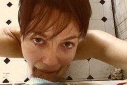 Bella Donna kneels before her hung lover and sucks her lover's big piece of meat