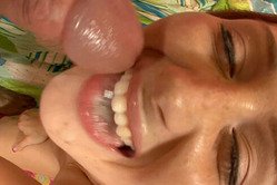 Cameron Love kneels in front of her lover and gives her lover a good blowjob