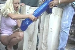 Curious dudes move a huge sex toy deep inside seductive blonde's tight pussy till she screams