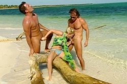 Super hot threesome on the beach, petite blondie sucks two dongs and get fucked like a total whore