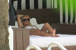 Nasty pervert spots a hot blonde bikini babe and gets in bed with her to ravage her juicy clam