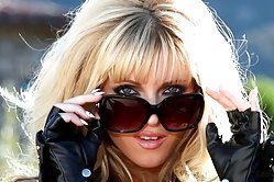 Slutty blonde model is eager to show off her sex appeal in this outdoors photo session, she's so hot