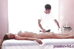 Dude gives hottie a back massage and moves on to kissing her pierced pussy on massage table