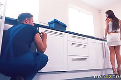 Talented brunette thanks a dude for help with a deep blowjob right on the floor of her kitchen