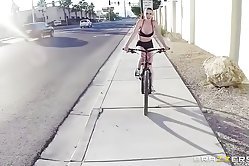 Busty babe rides her bicycle when she meets a strong dude who seduces her into pleasing his dick