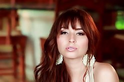 Redhead in white teasing her pussy